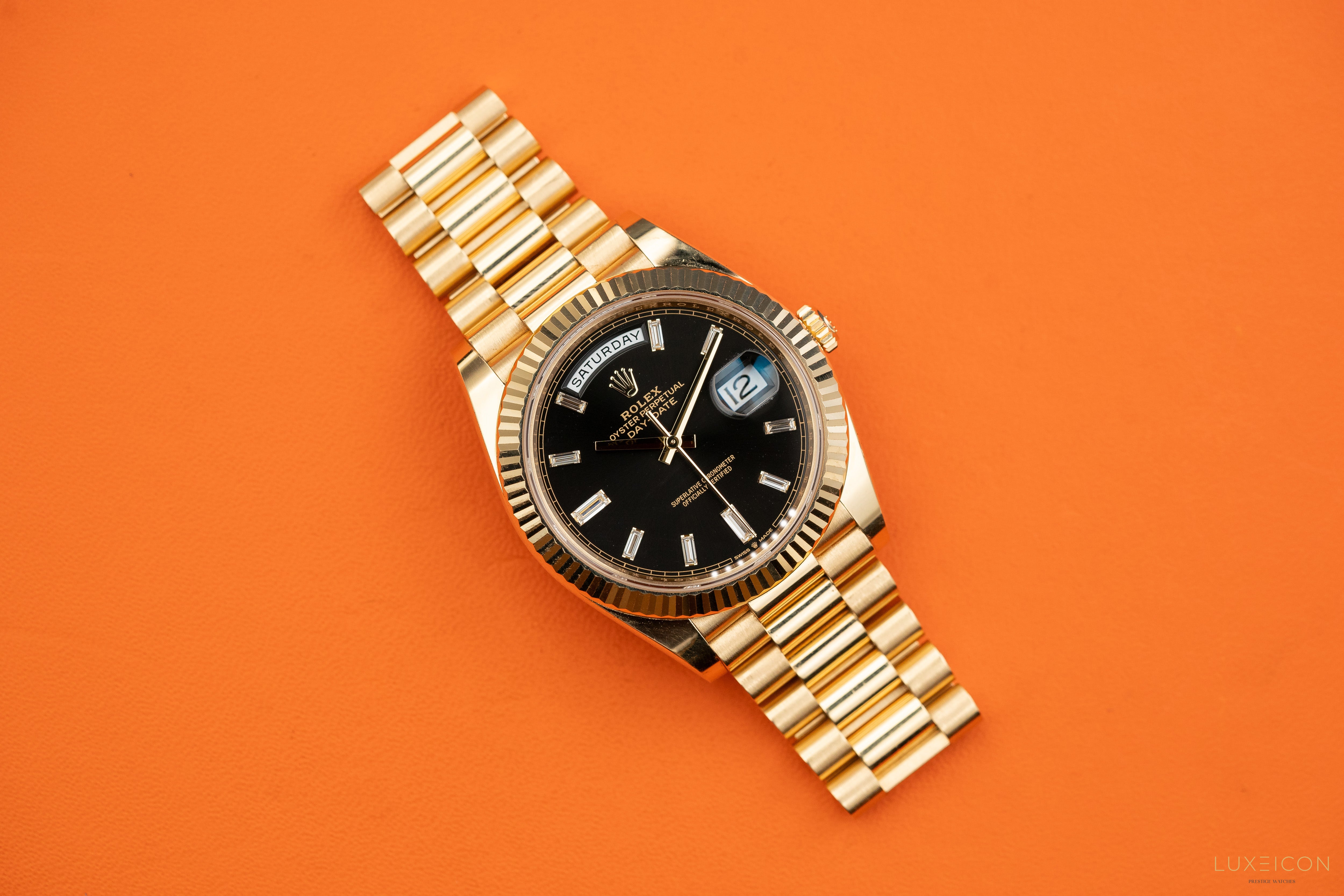 Rolex Day-Date 40mm Yellow Gold Black Diamond Baguette 228238
