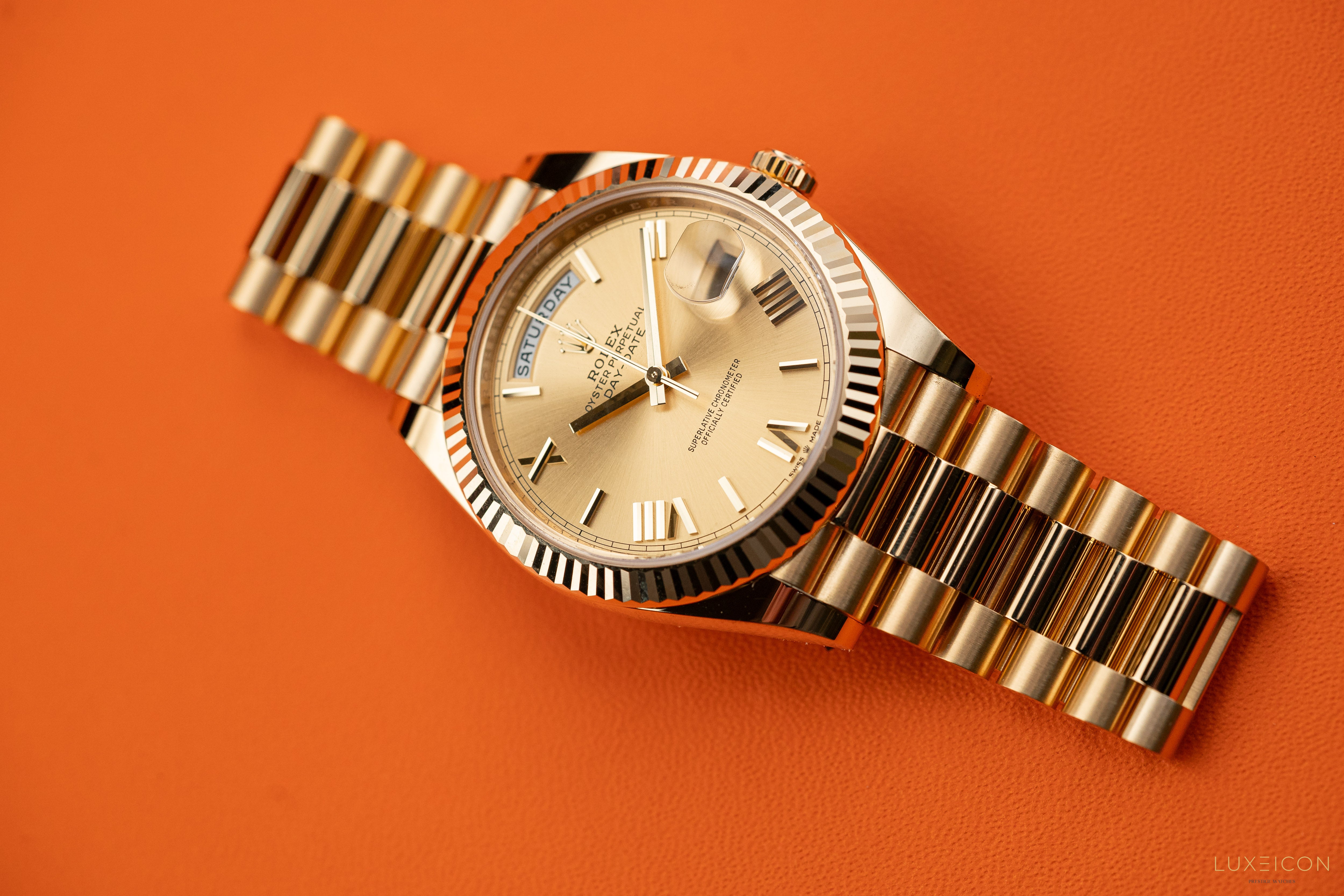 Rolex Day-Date 228238 40mm Champagne Gold Roman Dial President Bracelet Yellow Gold Fluted Bezel