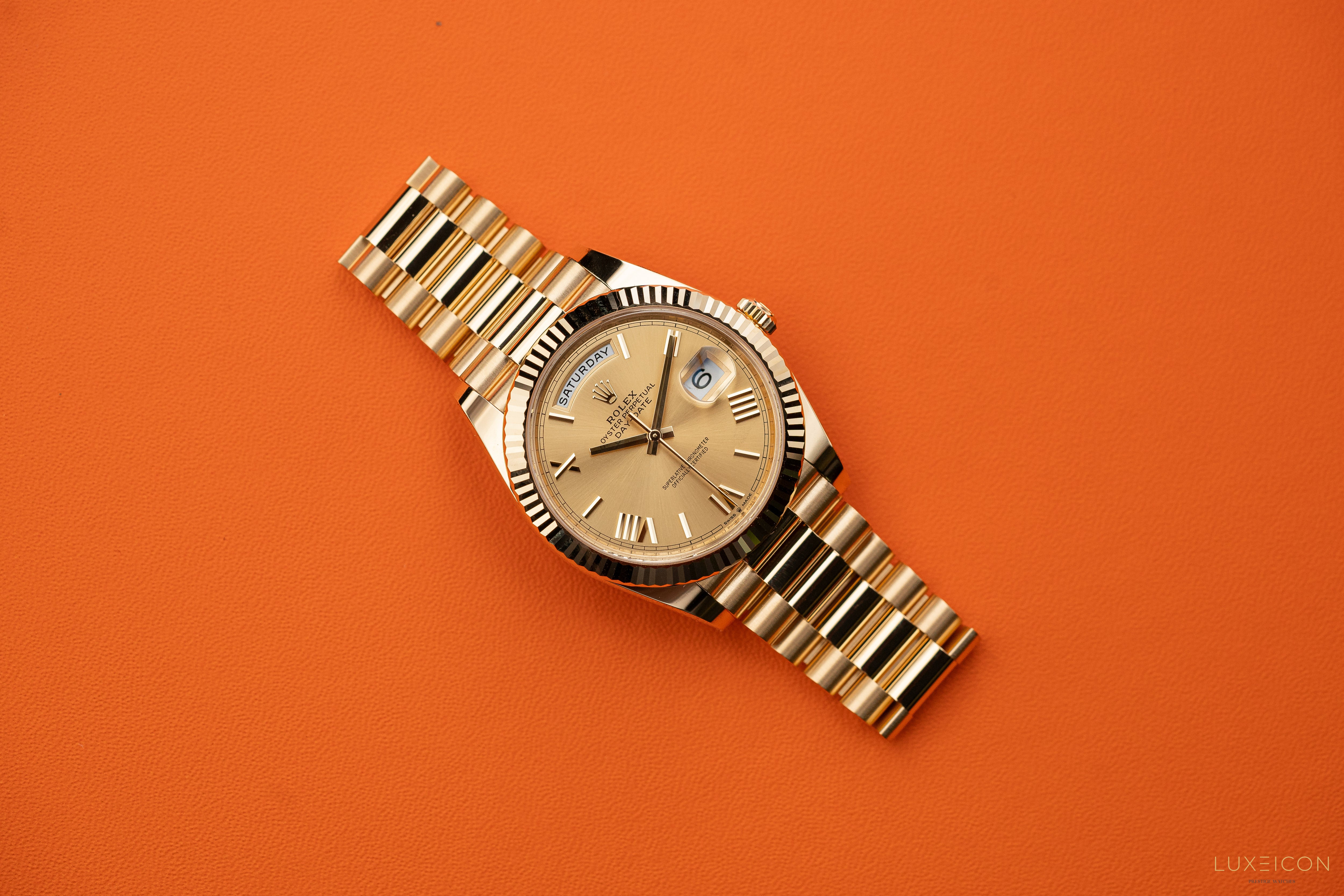 Rolex Day-Date 228238 40mm Champagne Gold Roman Dial President Bracelet Yellow Gold Fluted Bezel