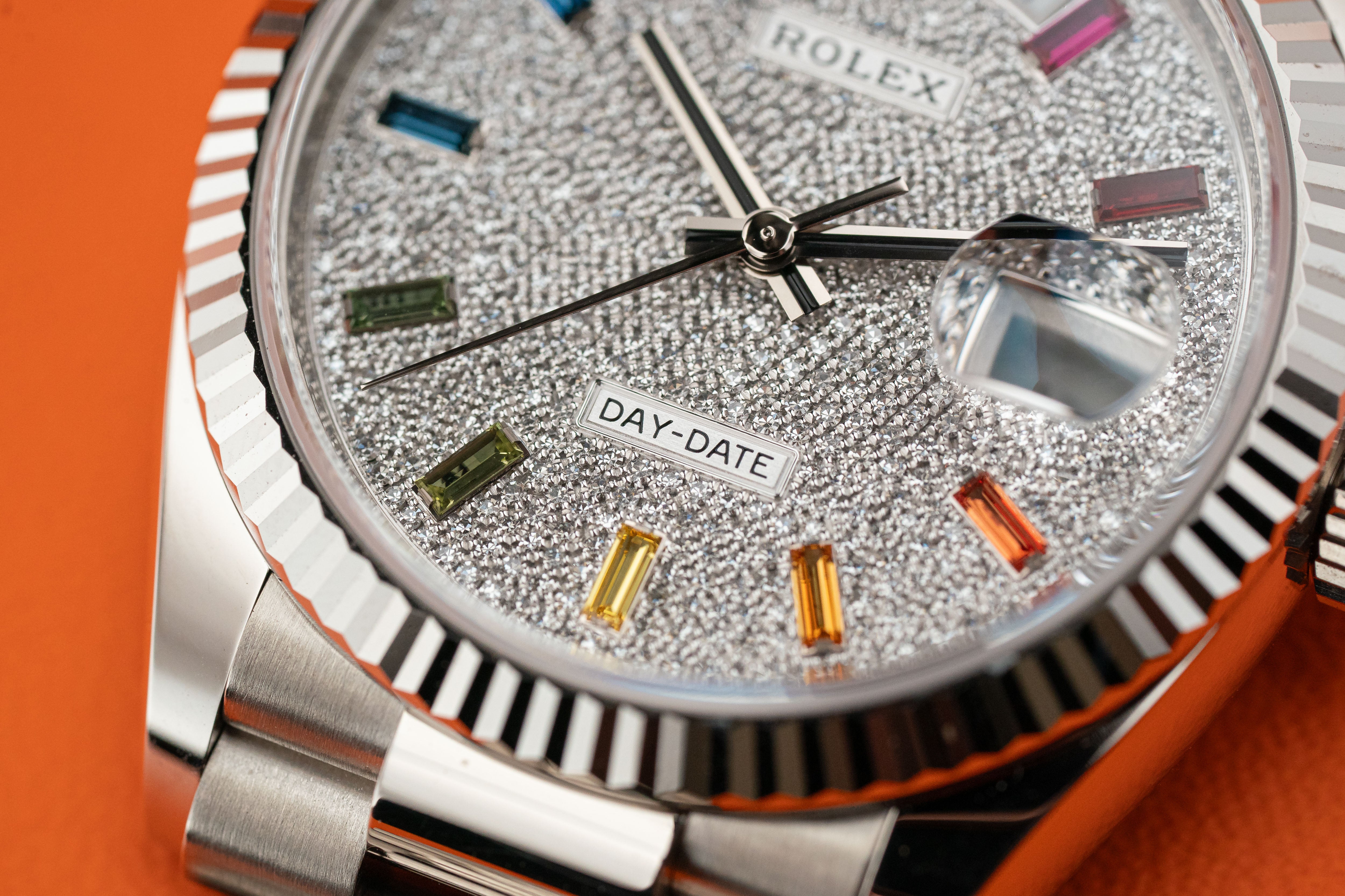 Rolex Day-Date 36mm White Gold Fluted Bezel Diamond Paved Rainbow Sapphire Dial 128239