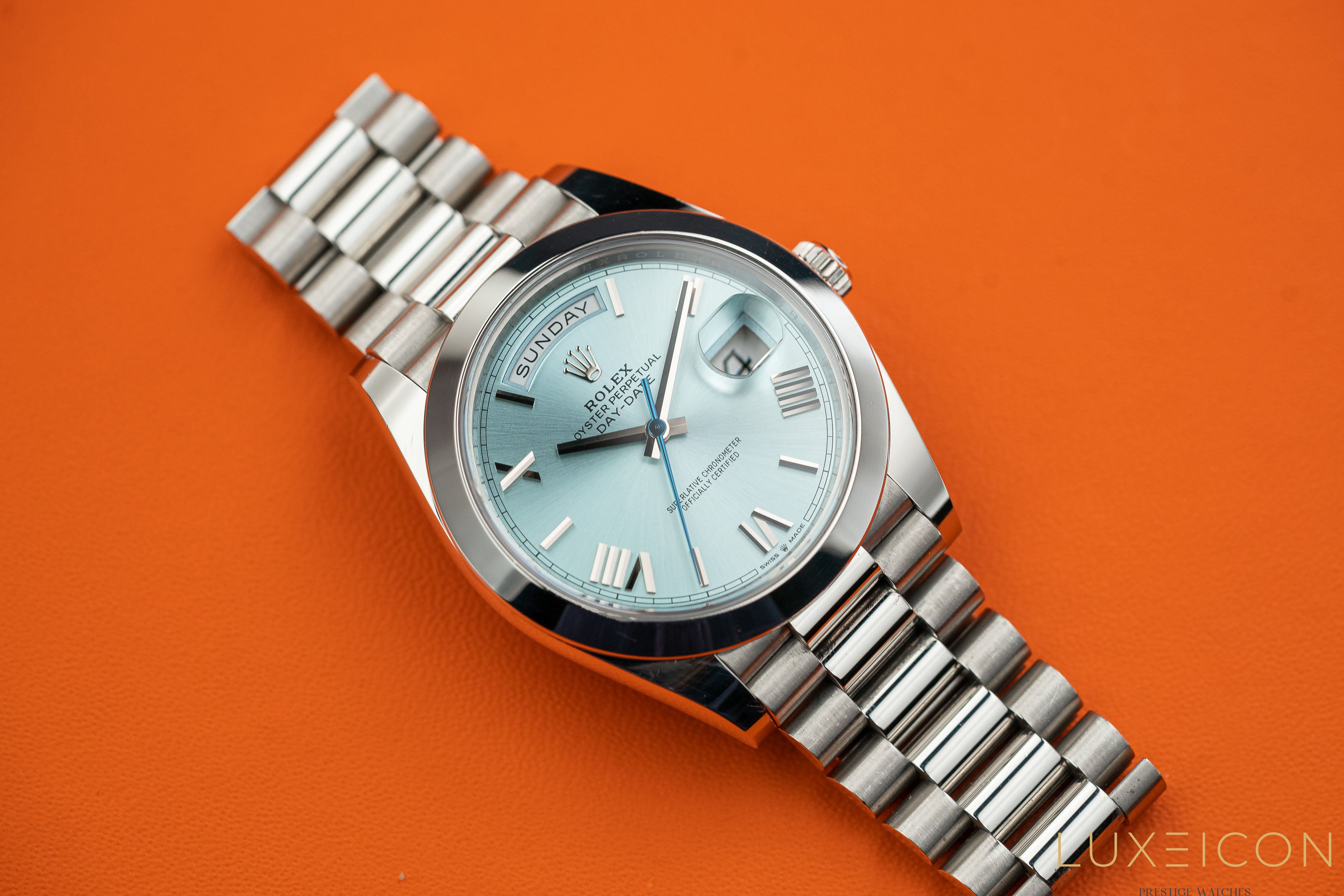 Rolex Day-Date 40MM Platinum Roman Ice Blue Dial Smooth Bezel 228206