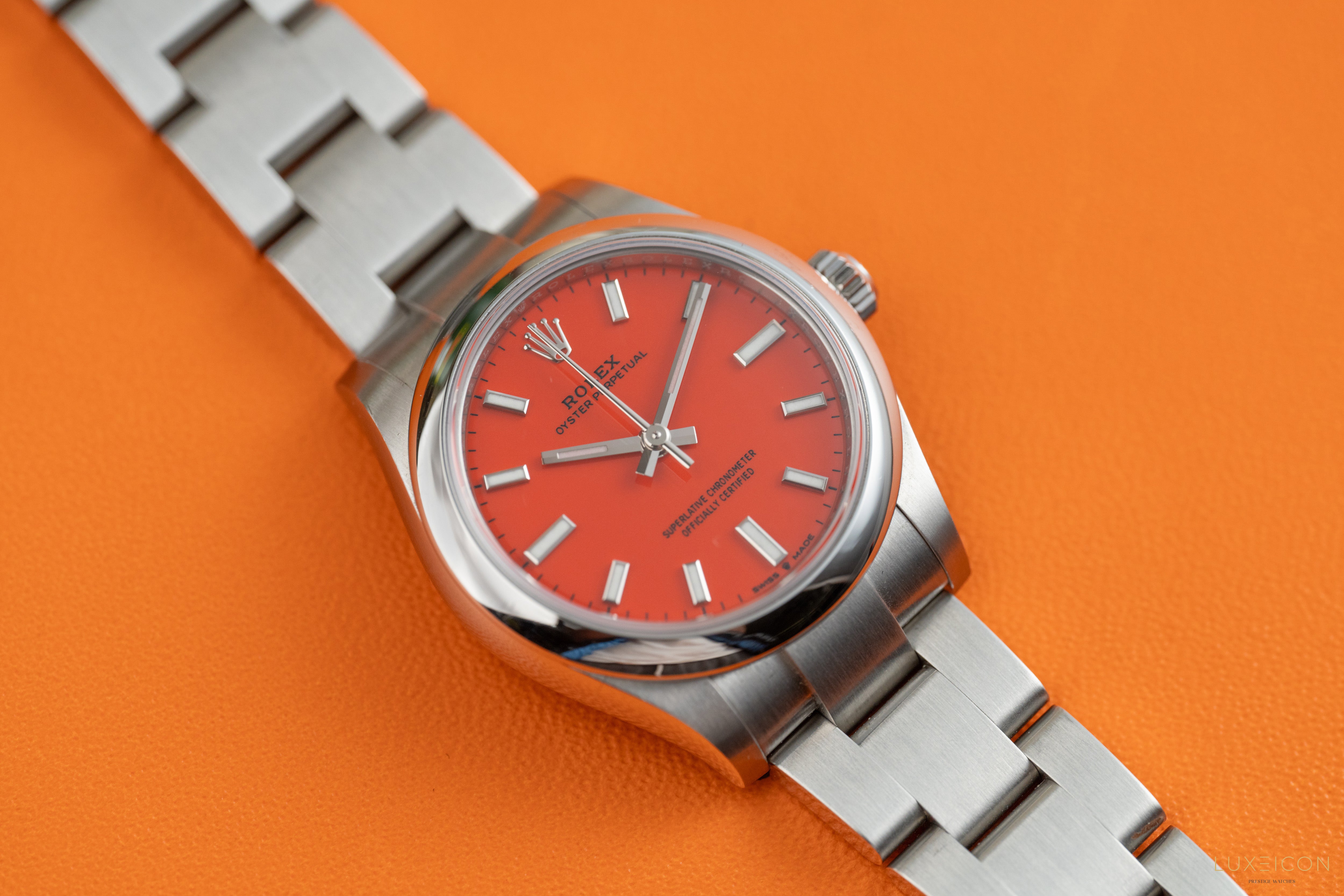 Rolex Oyster Perpetual 31mm Stainless Steel Smooth Bezel Coral Red Dial 277200 2021