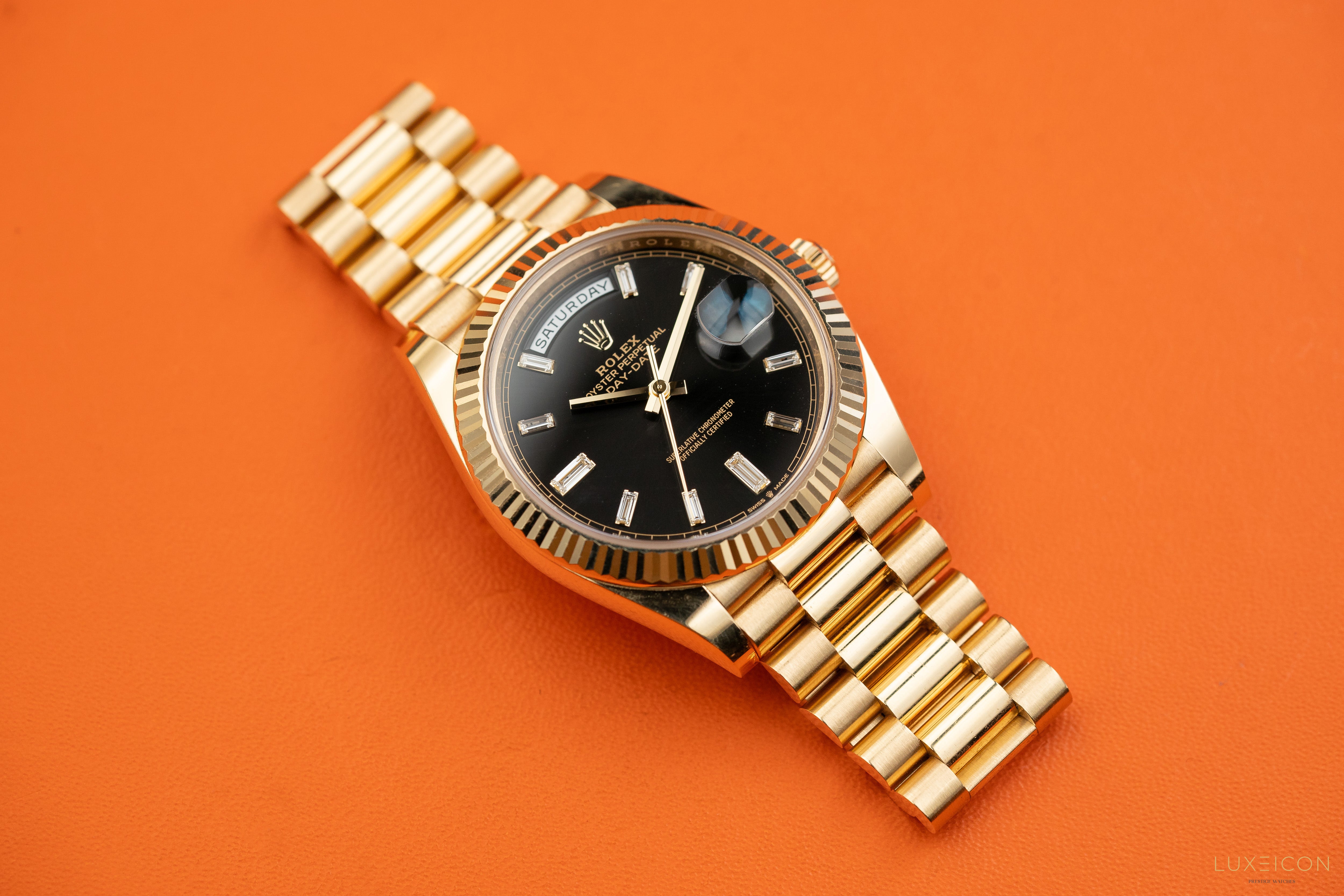 Rolex Day-Date 40mm Yellow Gold Black Diamond Baguette 228238