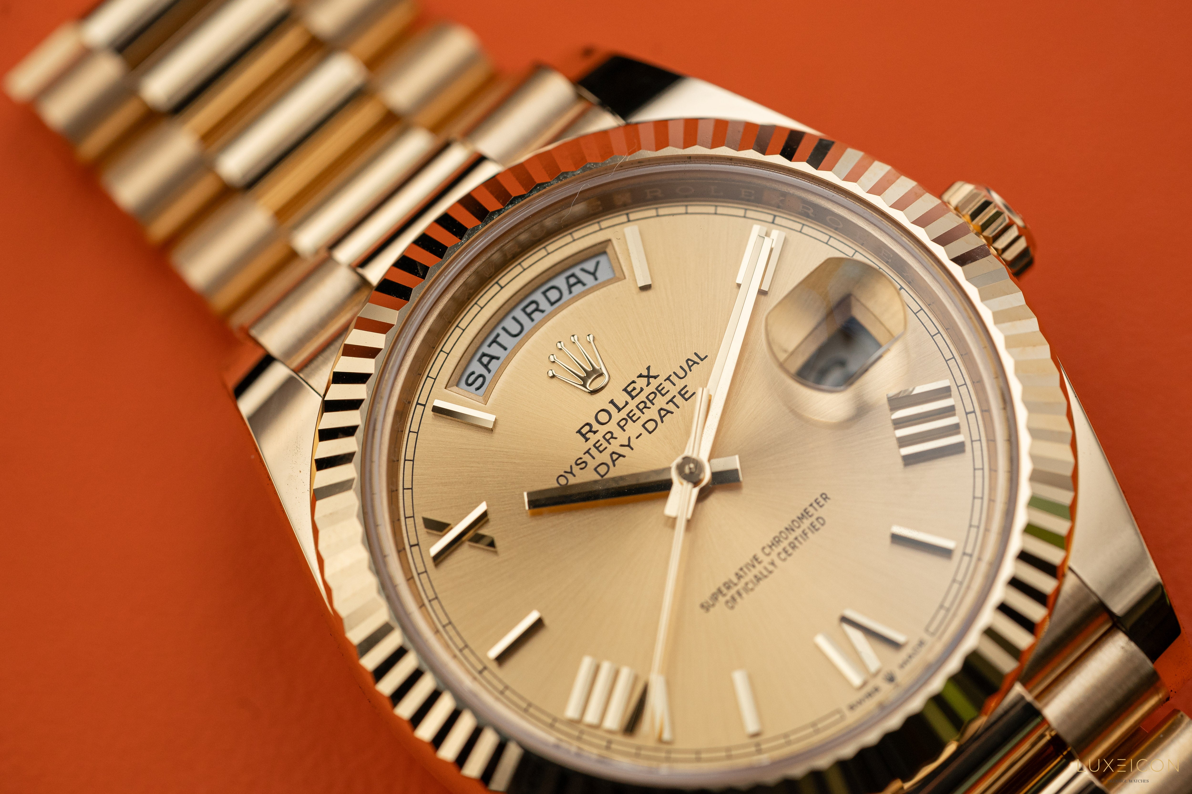 Rolex Day-Date 228238 40mm Champagne Gold Roman Dial President Bracelet Yellow Gold Fluted Bezel