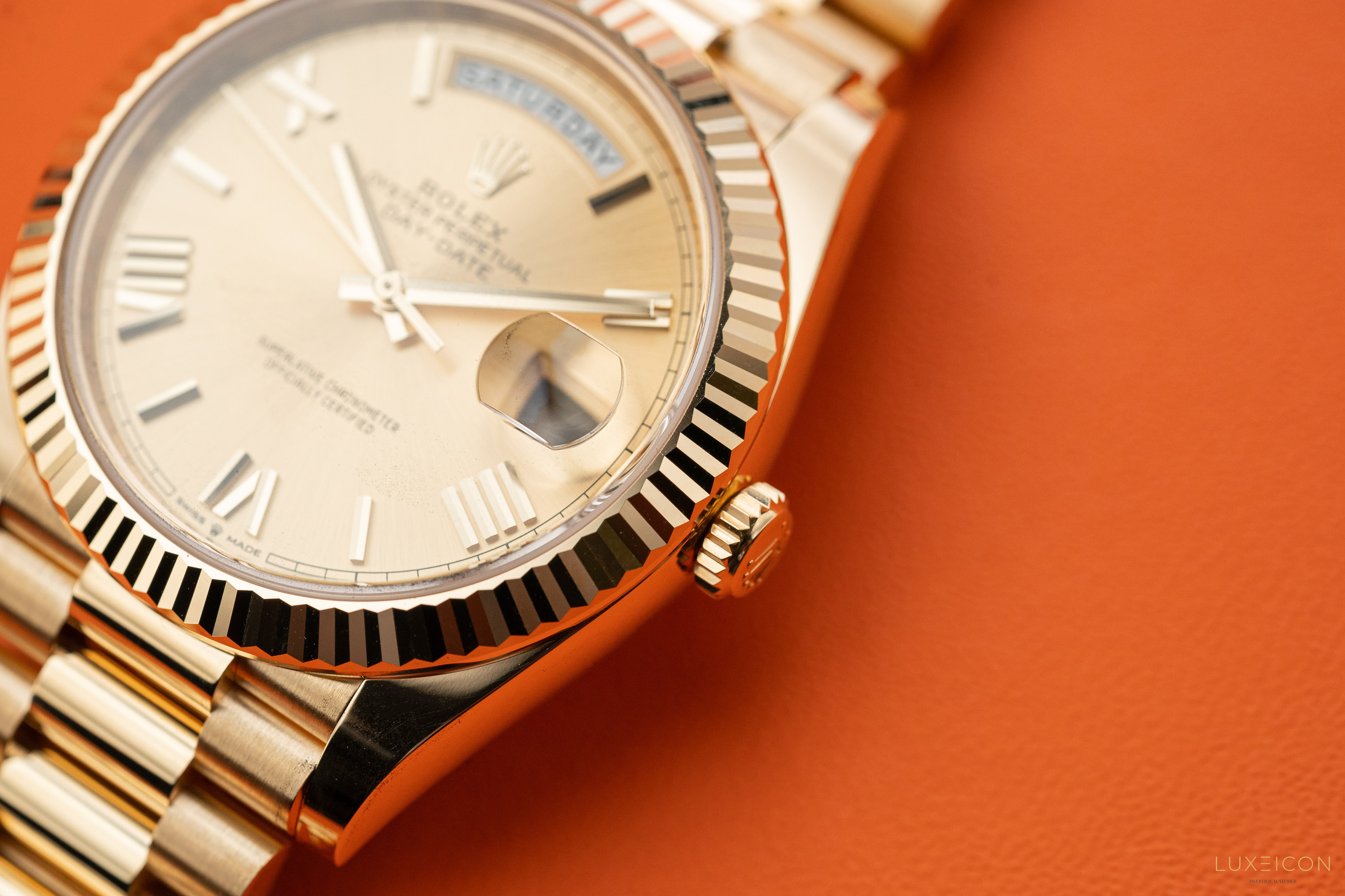 Rolex Day-Date 228238 40mm Champagne Gold Roman Dial President Bracelet Yellow Gold Fluted Bezel