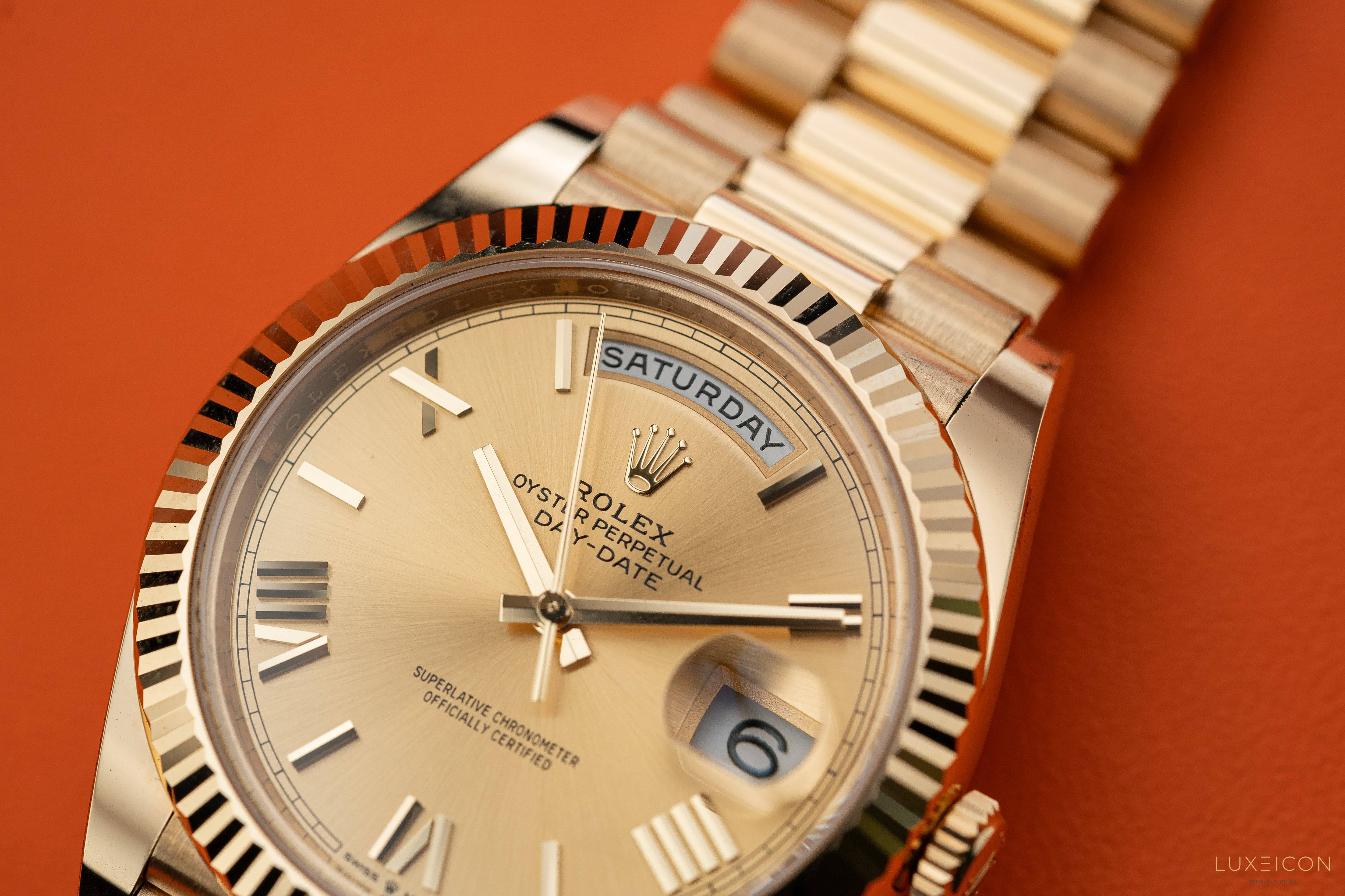 Rolex Day-Date 228238 40mm Champagne Gold Roman Dial President Bracelet Yellow Gold Fluted Bezel