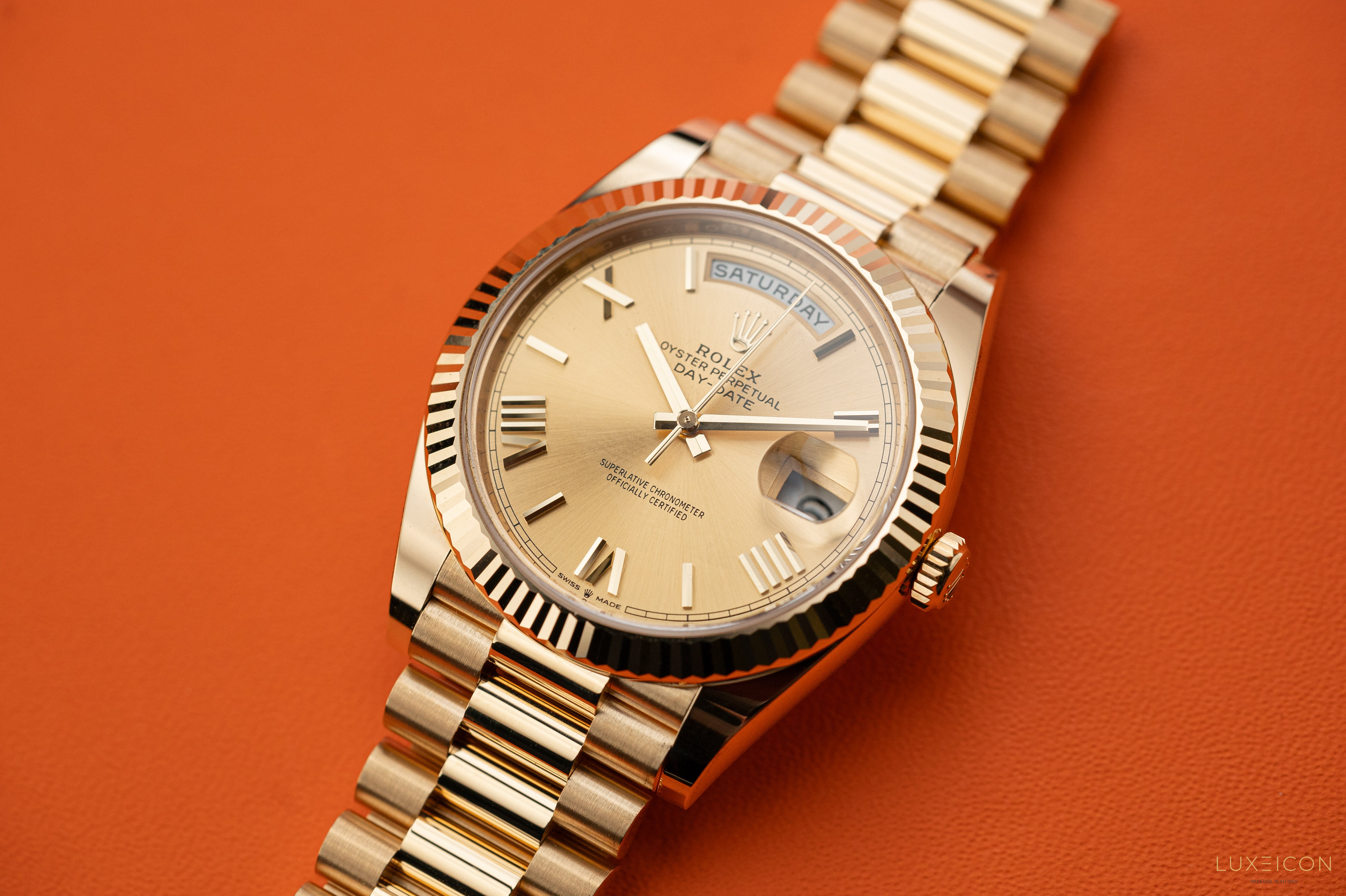 Rolex Day-Date 228238 40mm Champagne Gold Roman Dial President Bracelet Yellow Gold Fluted Bezel