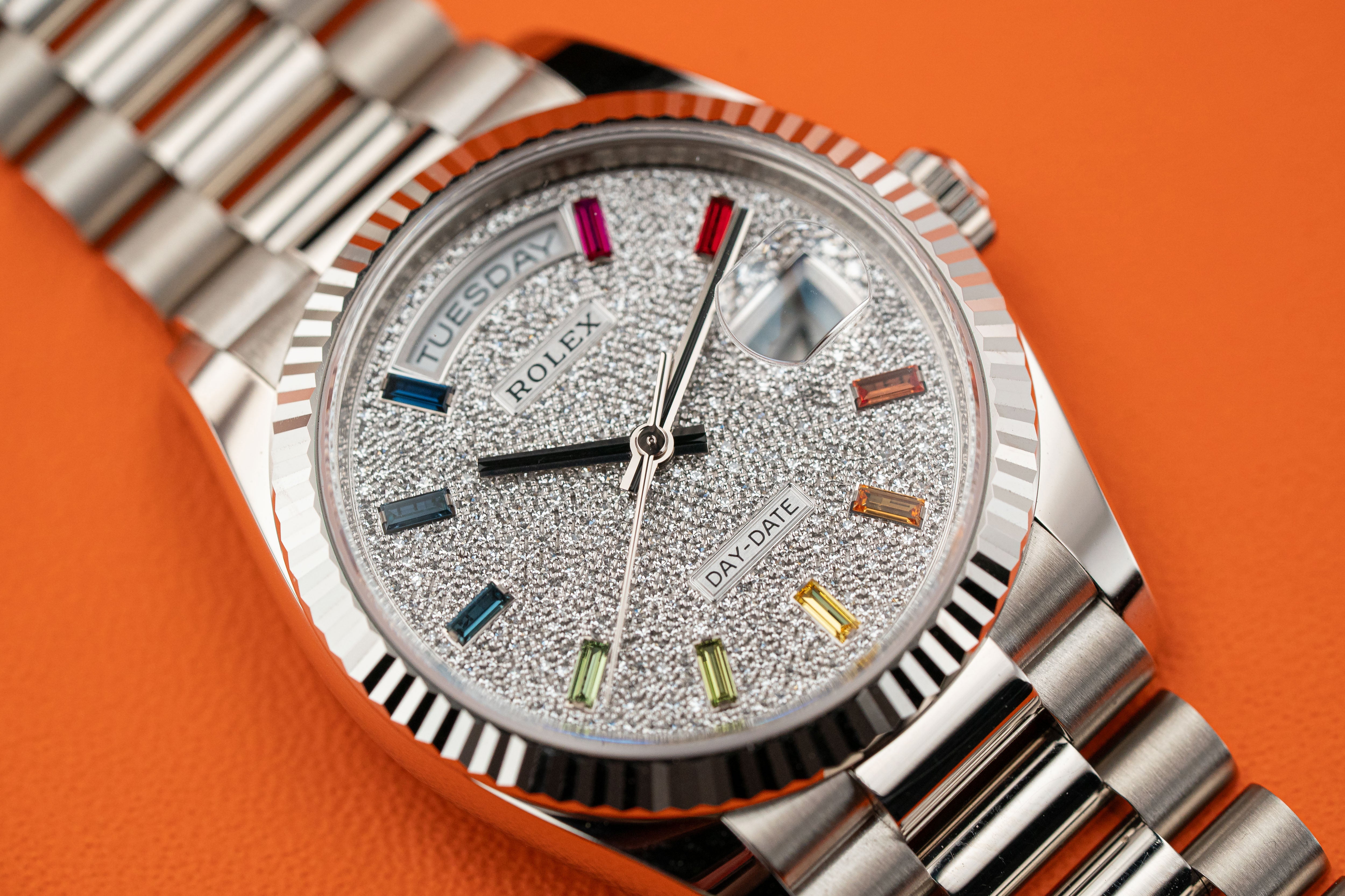 Rolex Day-Date 36mm White Gold Fluted Bezel Diamond Paved Rainbow Sapphire Dial 128239