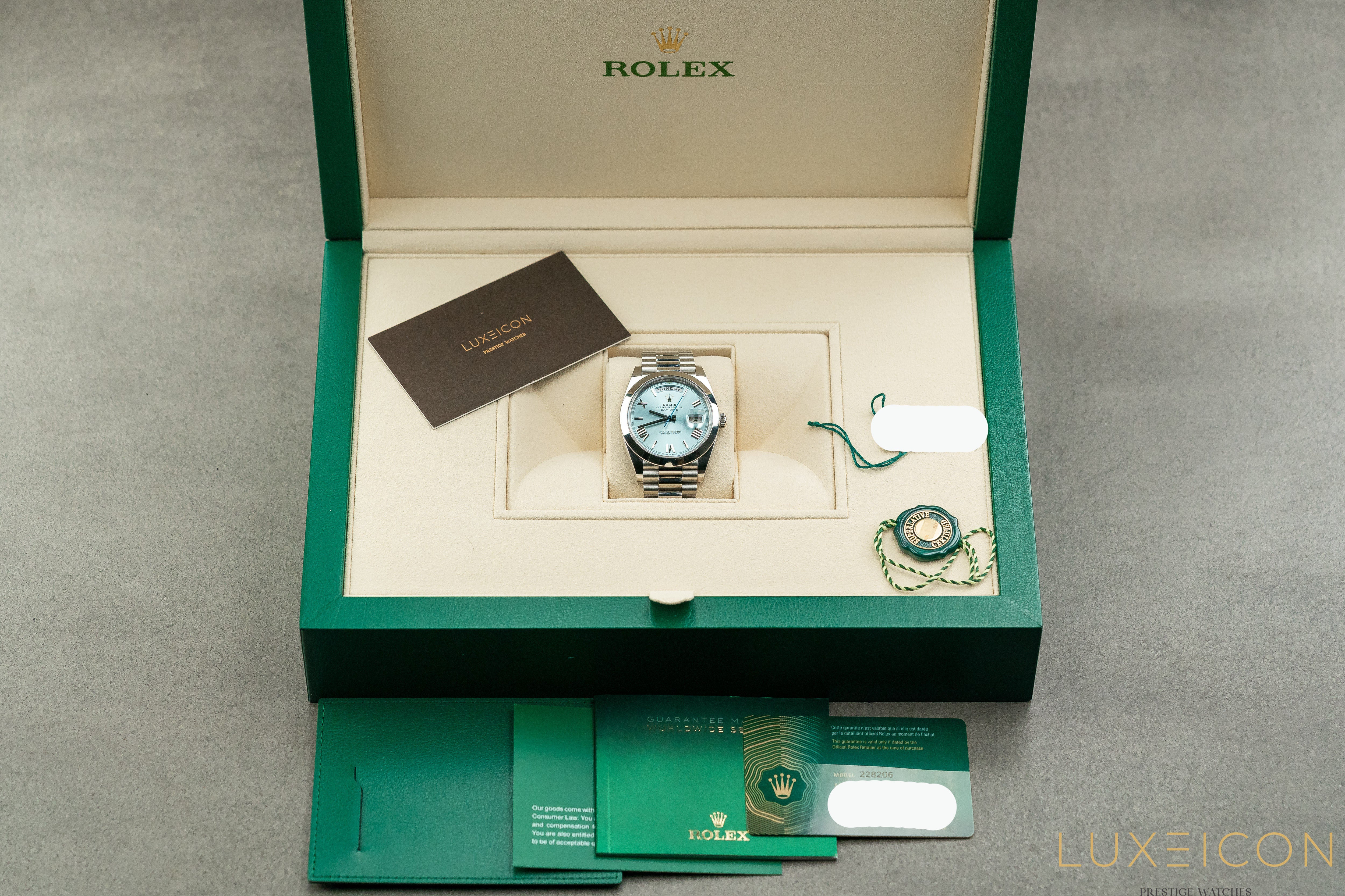 Rolex Day-Date 40MM Platinum Roman Ice Blue Dial Smooth Bezel 228206