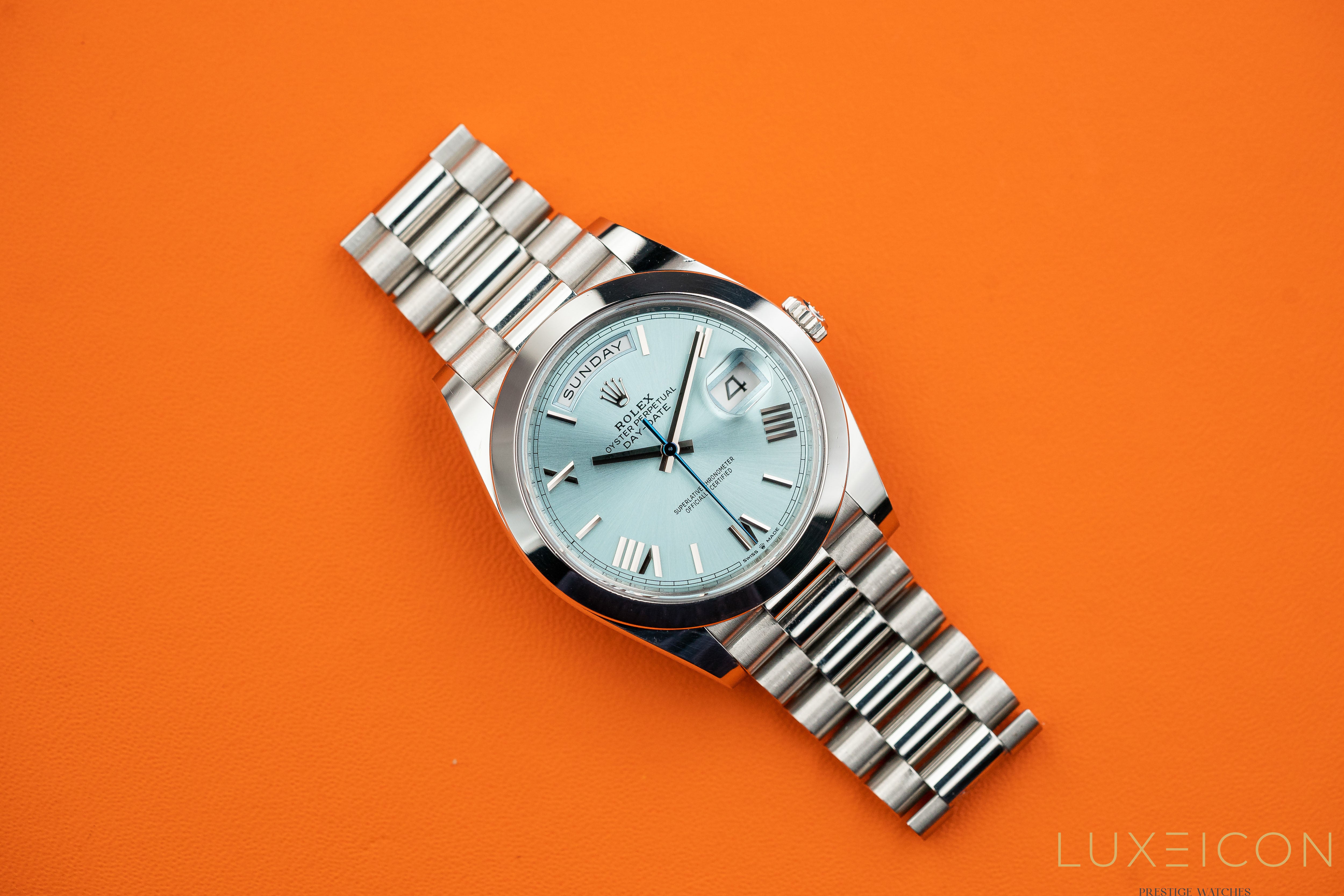 Rolex Day-Date 40MM Platinum Roman Ice Blue Dial Smooth Bezel 228206