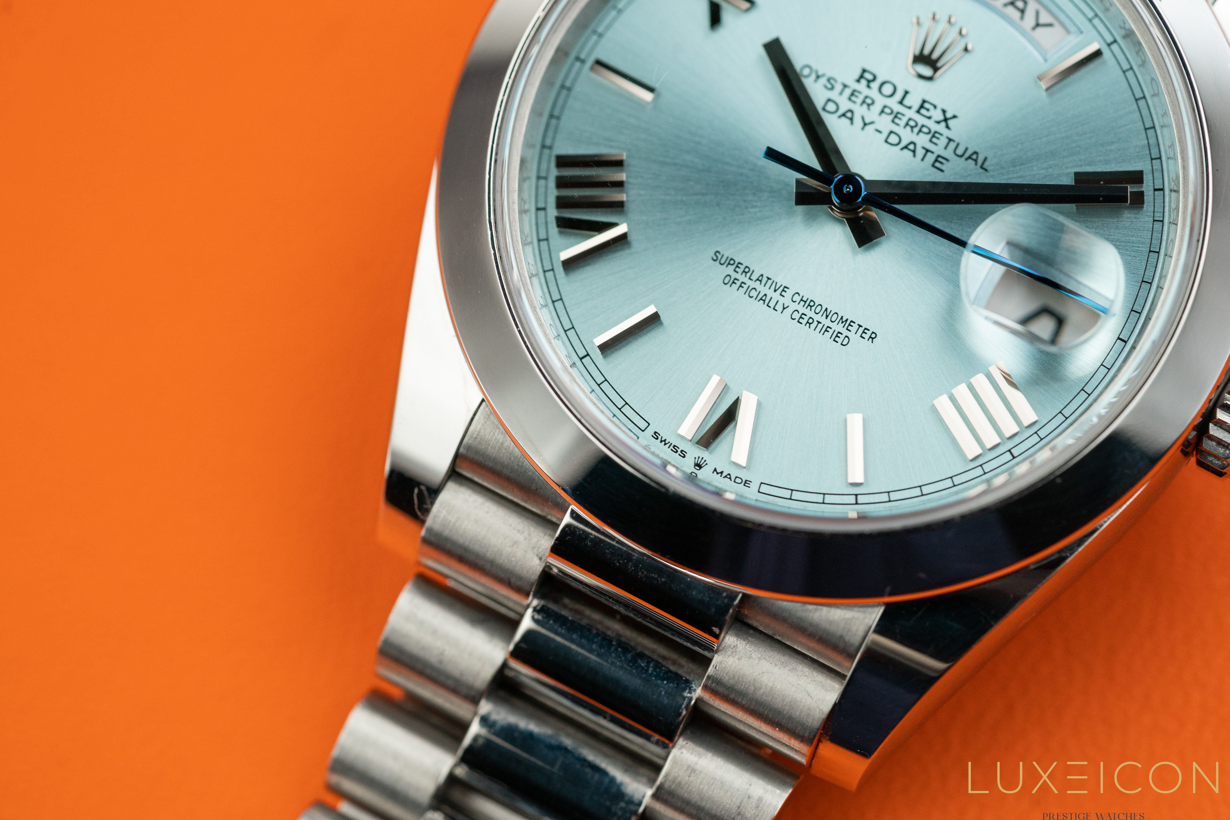 Rolex Day-Date 40MM Platinum Roman Ice Blue Dial Smooth Bezel 228206