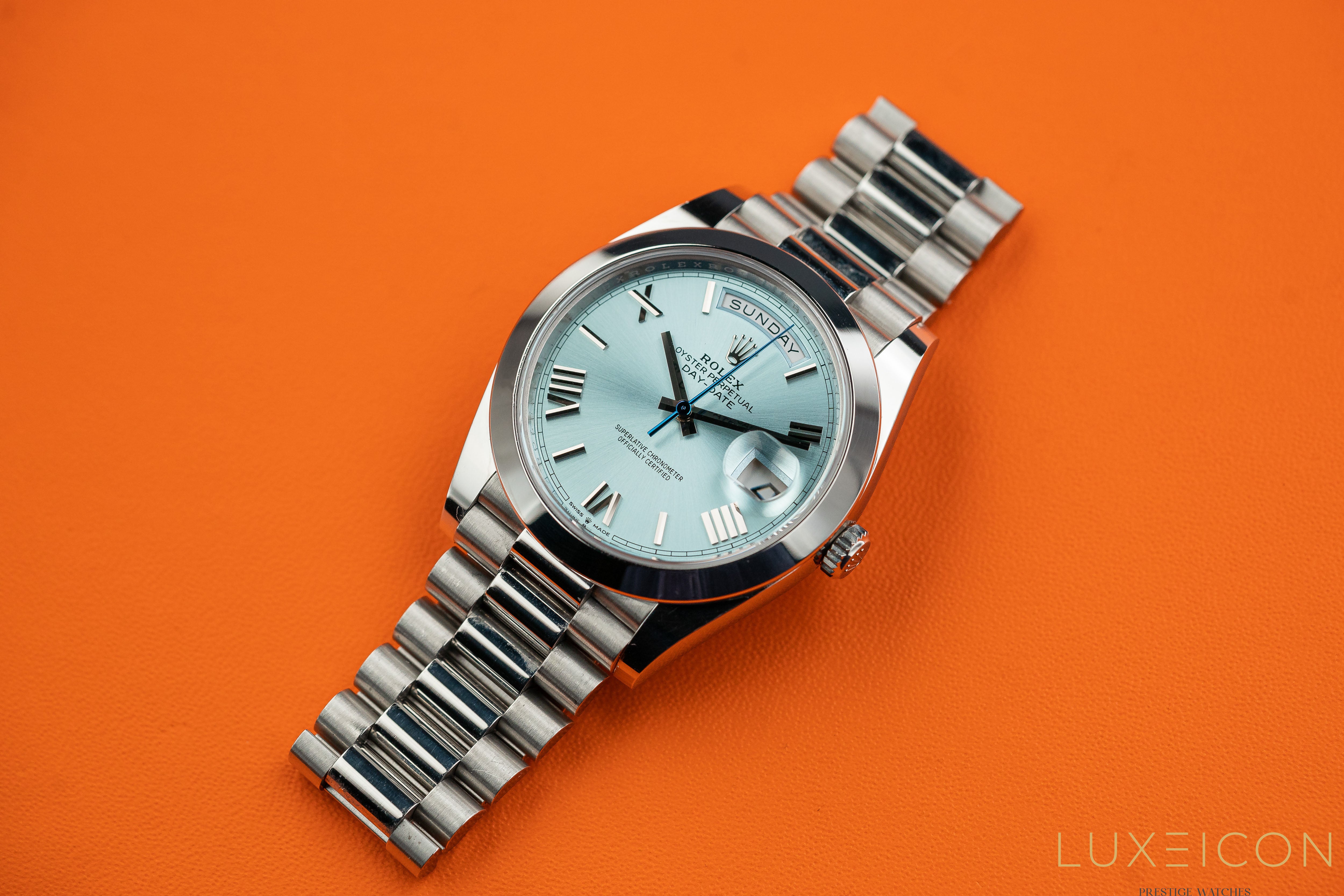 Rolex Day-Date 40MM Platinum Roman Ice Blue Dial Smooth Bezel 228206