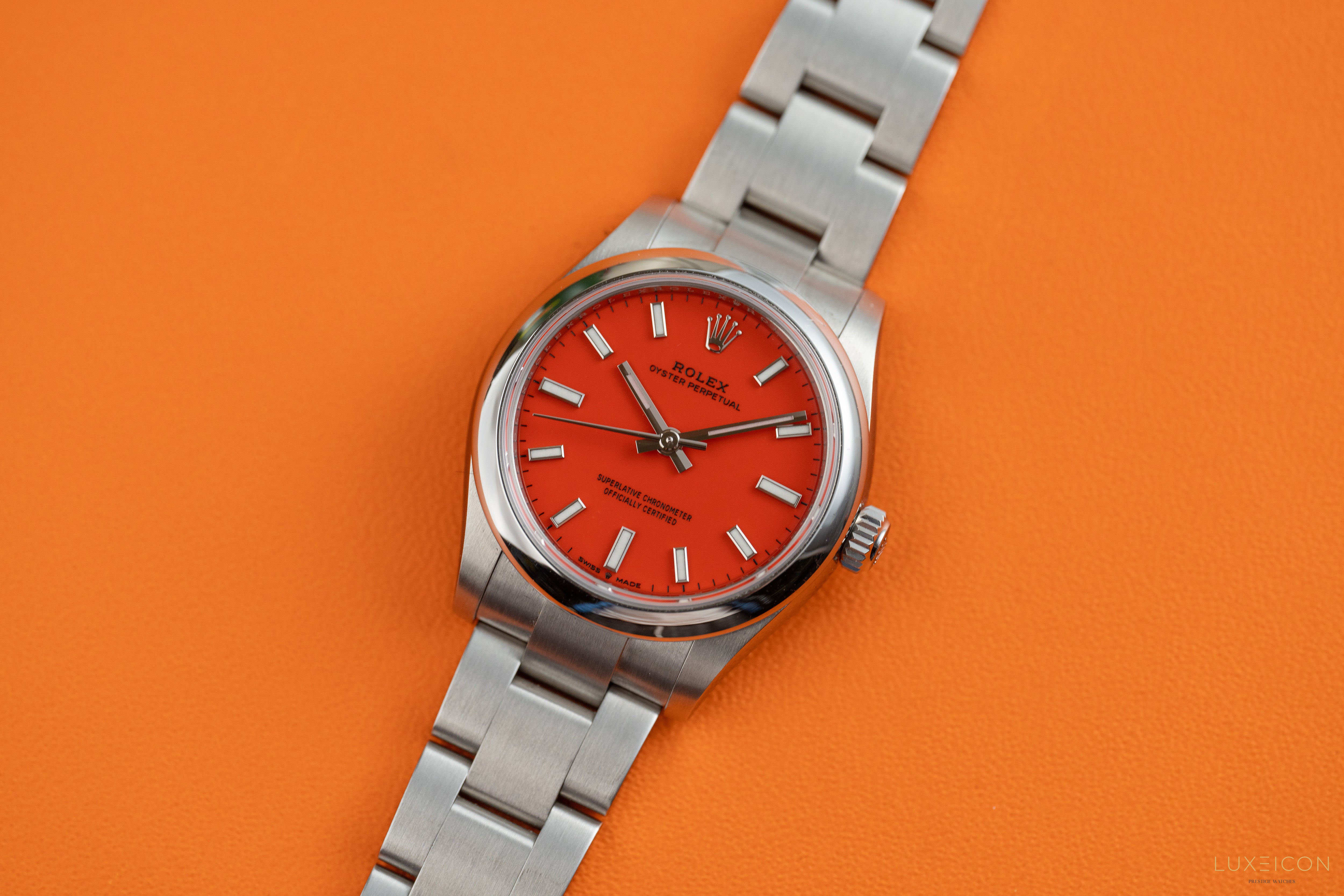 Rolex Oyster Perpetual 31mm Stainless Steel Smooth Bezel Coral Red Dial 277200 2021